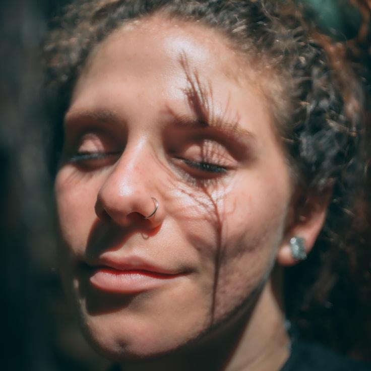 Kaveri Mehta, Lead Design Curator at Open Field Communication, reviewing corporate floral arrangements